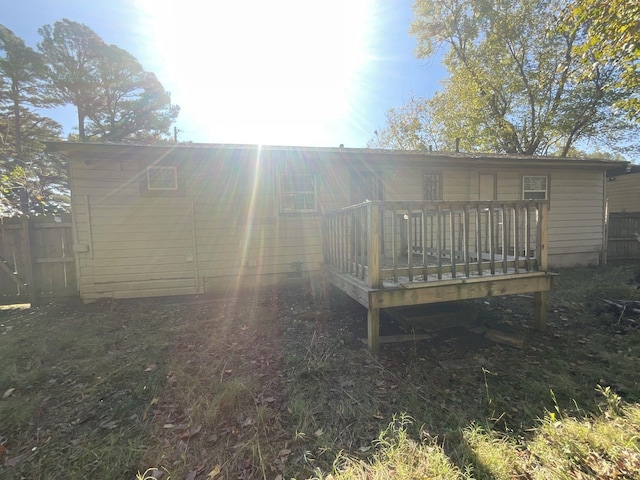 back of house with a wooden deck