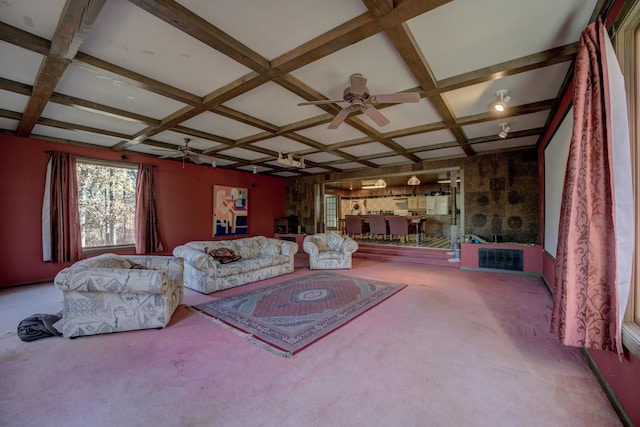 carpeted living room with beamed ceiling, ceiling fan, and coffered ceiling