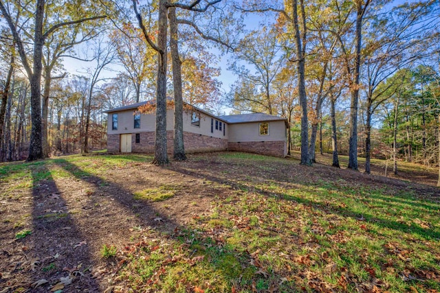 view of home's exterior featuring a yard