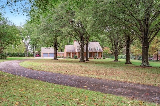 cape cod home with a front lawn