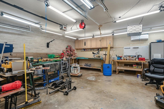 garage featuring a workshop area and a garage door opener