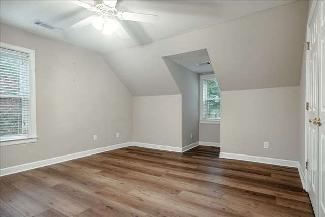 additional living space featuring hardwood / wood-style floors, ceiling fan, and vaulted ceiling