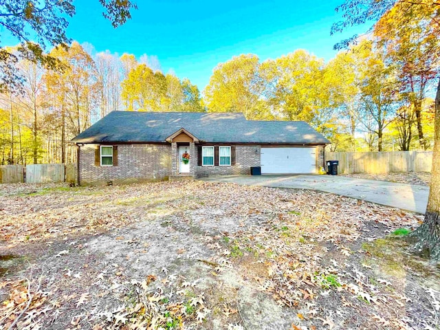 ranch-style home featuring a garage