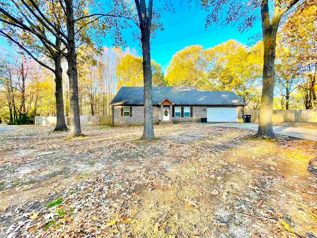 ranch-style house featuring a garage