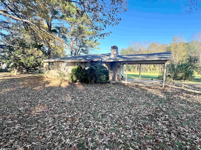 exterior space with a carport