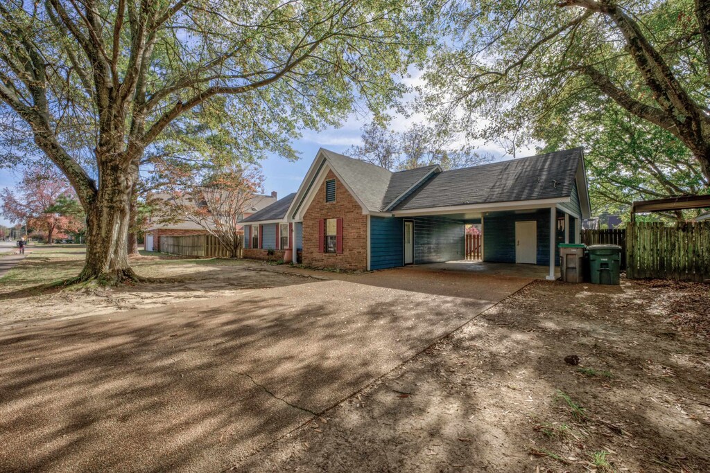7555 Reese Rd, Memphis, TN 38133 - view of side of property featuring a carport