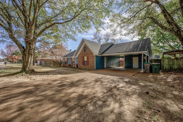 view of side of property featuring a carport