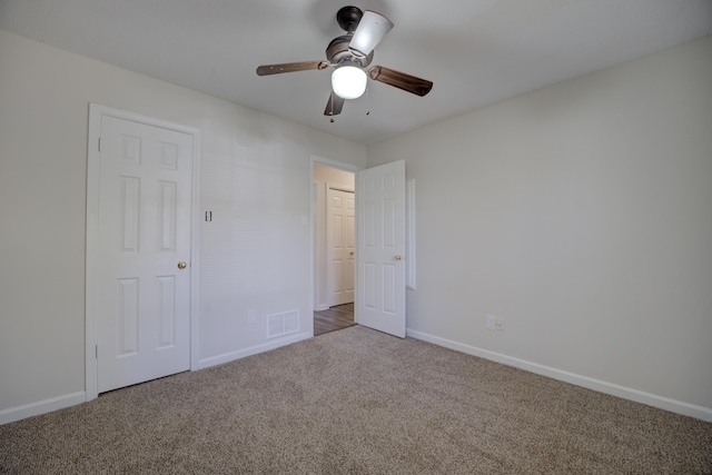 unfurnished bedroom featuring carpet flooring and ceiling fan