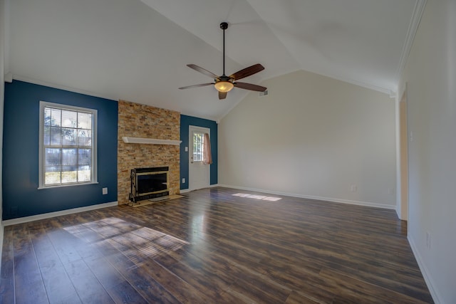 unfurnished living room with dark wood-type flooring, high vaulted ceiling, ceiling fan, ornamental molding, and a fireplace