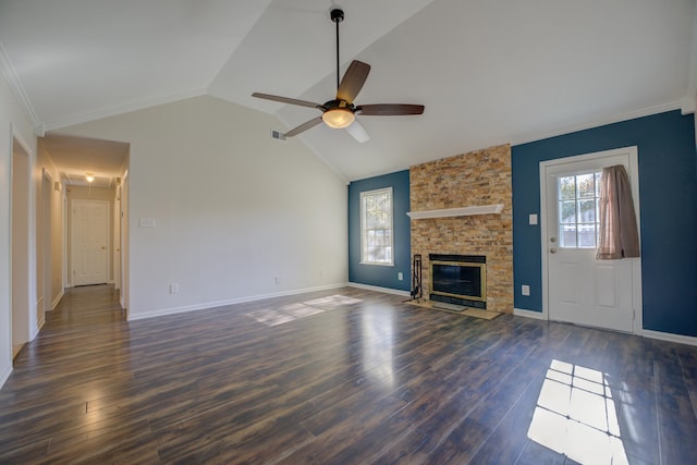 unfurnished living room with vaulted ceiling, ceiling fan, dark wood-type flooring, and a stone fireplace