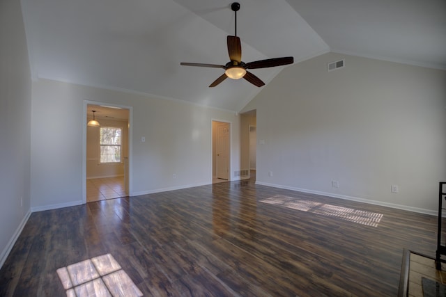 interior space featuring dark hardwood / wood-style floors, ceiling fan, lofted ceiling, and ornamental molding