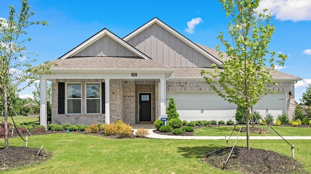 craftsman-style home with a front lawn and a garage