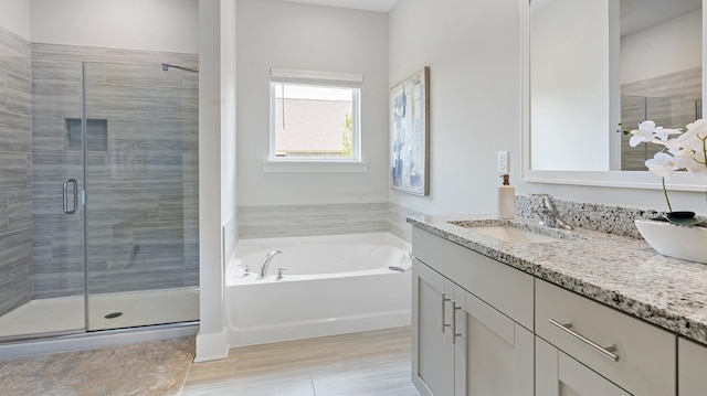 bathroom with vanity and plus walk in shower