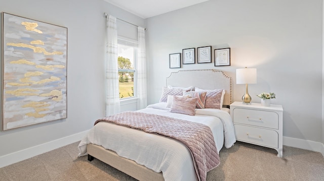 bedroom featuring light colored carpet