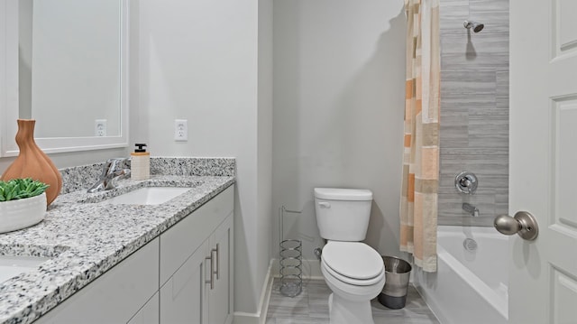 full bathroom with toilet, vanity, and shower / bath combo with shower curtain