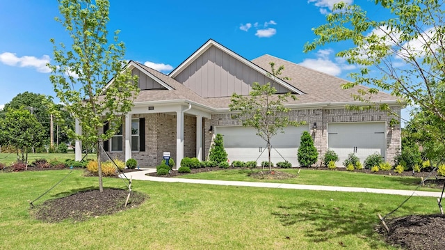 craftsman-style home with a front lawn and a garage