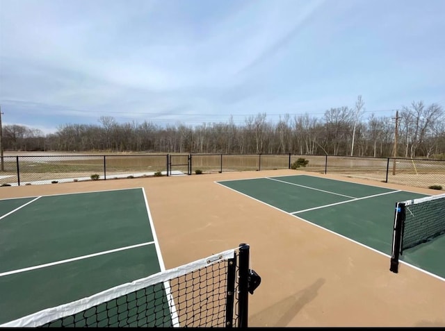 view of sport court with basketball hoop