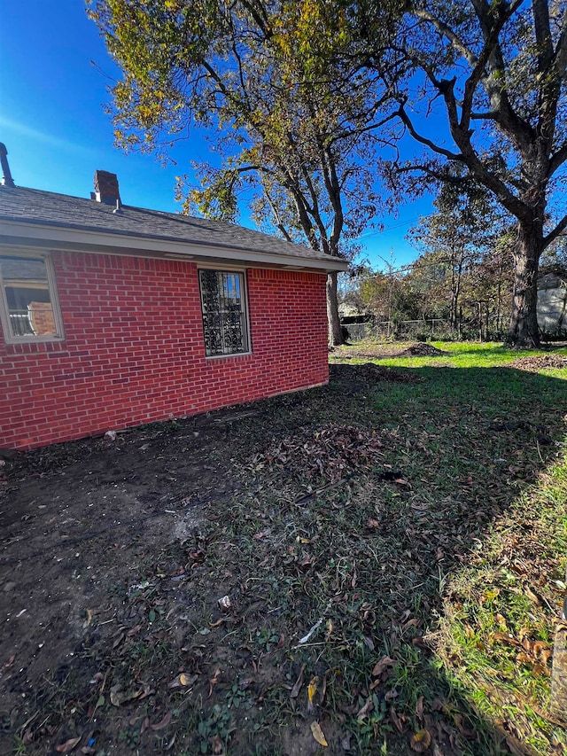 view of home's exterior with a lawn