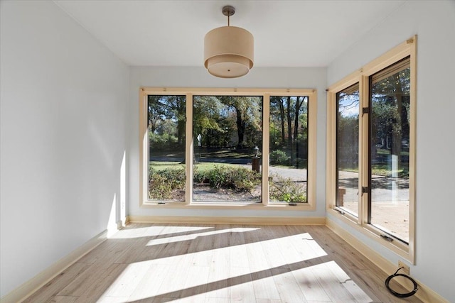 unfurnished sunroom featuring a healthy amount of sunlight