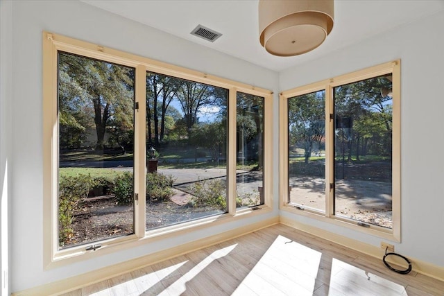 unfurnished sunroom featuring plenty of natural light