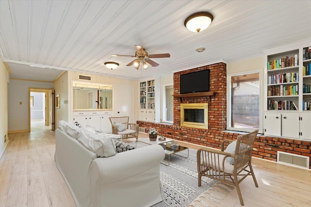 living room featuring built in shelves, wood ceiling, ornamental molding, and light hardwood / wood-style flooring