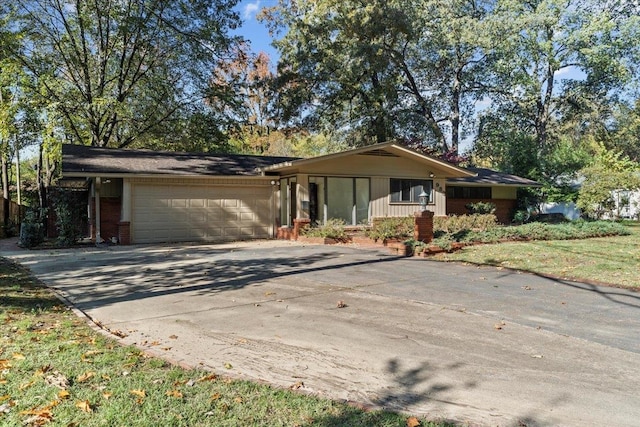 ranch-style home featuring a garage