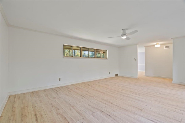 unfurnished room featuring light hardwood / wood-style flooring, ceiling fan, and ornamental molding