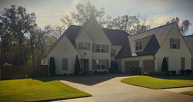 view of front facade featuring a garage and a front lawn