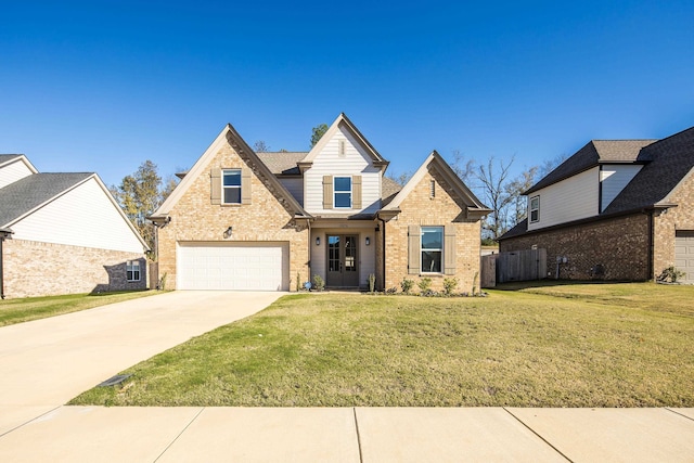 view of front of property with a garage and a front yard