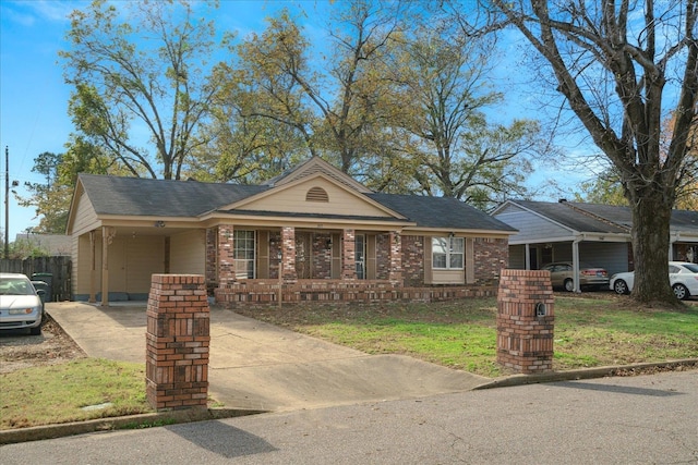 single story home featuring a carport and a front yard