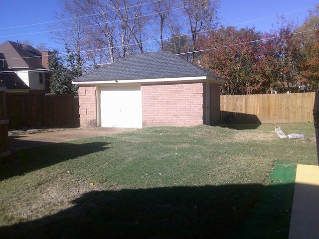 garage with a lawn