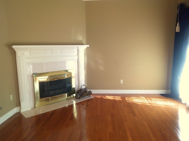 room details with hardwood / wood-style flooring and a fireplace