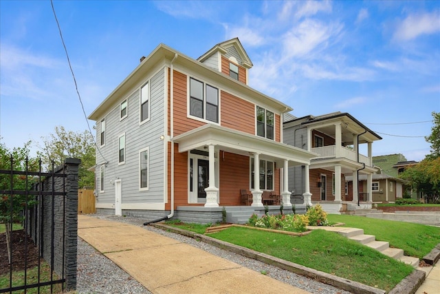 view of front of house featuring a balcony and a porch