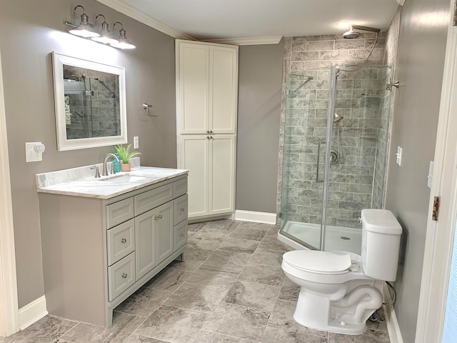 bathroom with vanity, toilet, an enclosed shower, and crown molding