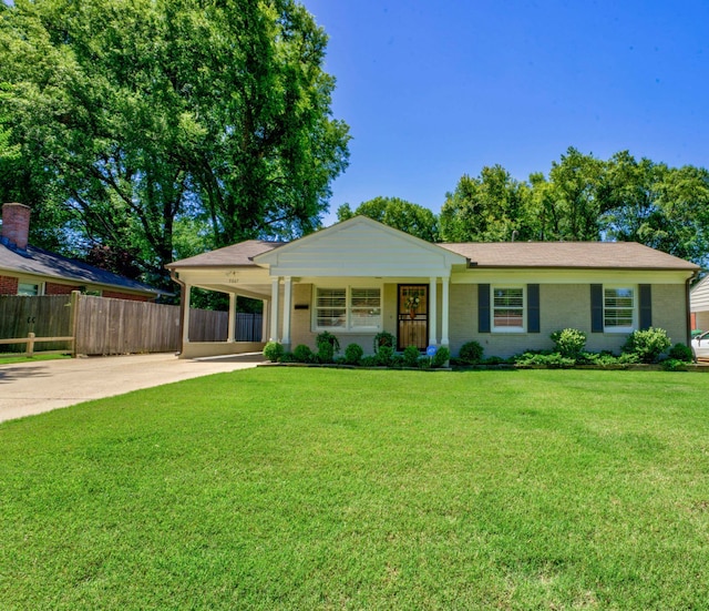 ranch-style home featuring a carport, a porch, and a front lawn