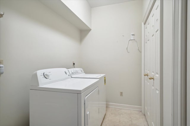 laundry room with washing machine and clothes dryer