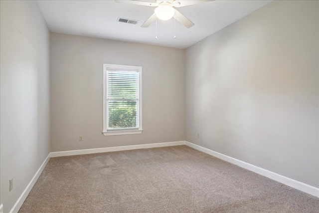 empty room featuring ceiling fan and carpet floors