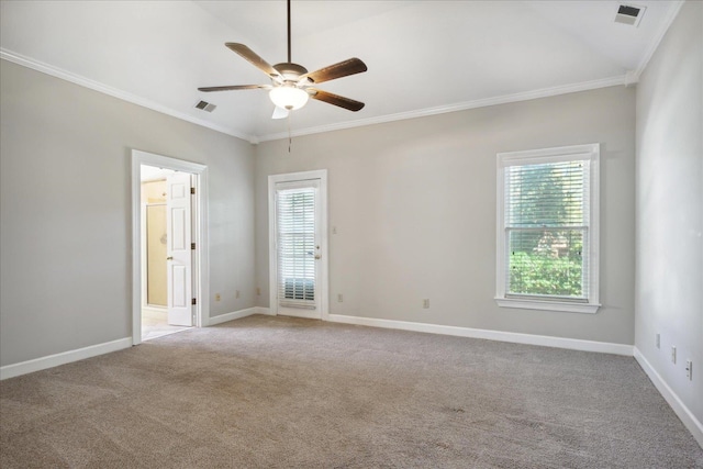 empty room featuring light carpet, a wealth of natural light, and ornamental molding