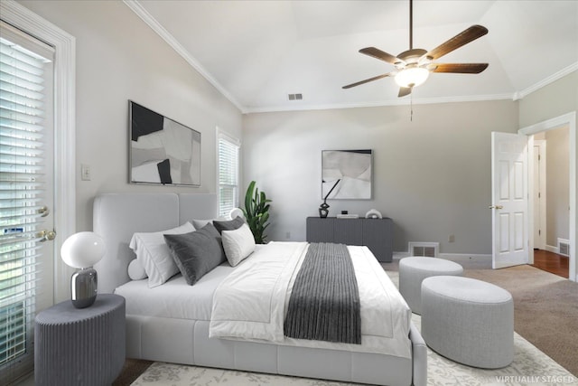 bedroom with hardwood / wood-style flooring, ceiling fan, vaulted ceiling, and multiple windows