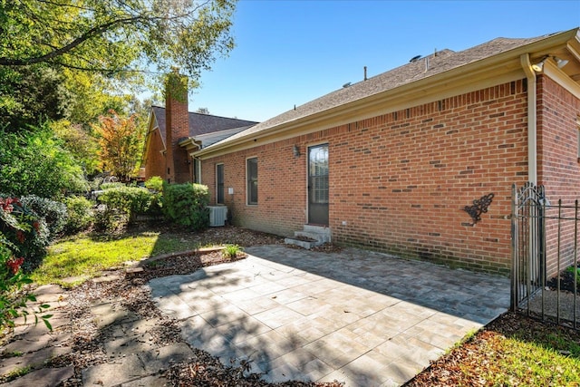 exterior space with cooling unit and a patio