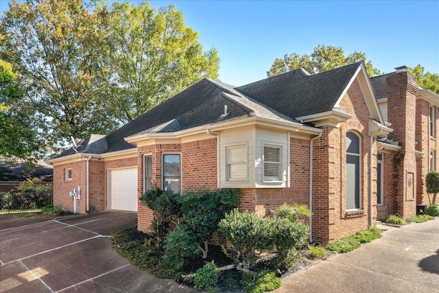 view of side of property with a garage