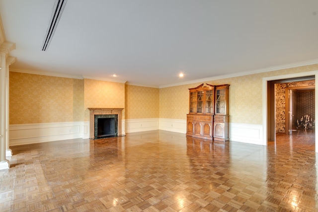 unfurnished living room featuring a fireplace, ornamental molding, and parquet flooring