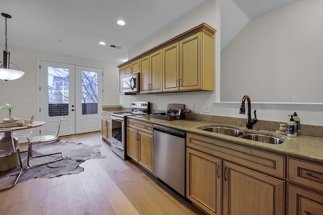 57 W Georgia Ave W Unit 102, Memphis, TN 38103 - kitchen featuring stainless steel appliances, french doors, light wood-style flooring, recessed lighting, and hanging light fixtures