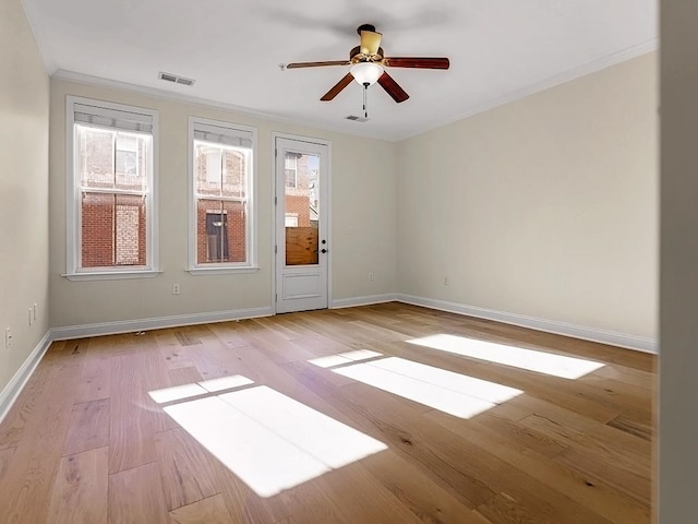 unfurnished room with ceiling fan, light hardwood / wood-style flooring, and ornamental molding