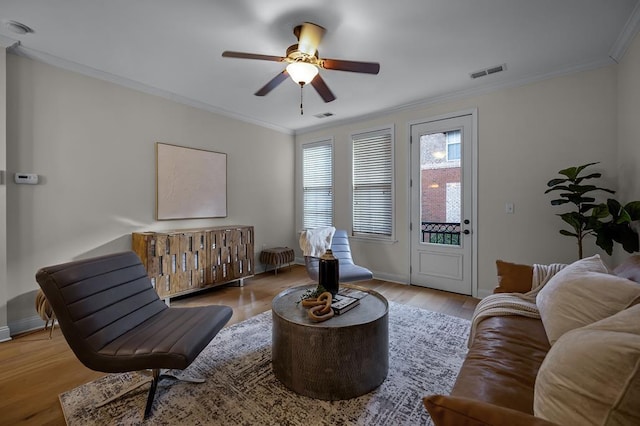57 W Georgia Ave W Unit 102, Memphis, TN 38103 - living room featuring a ceiling fan, wood finished floors, and ornamental molding