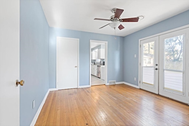 interior space featuring ceiling fan, french doors, and light hardwood / wood-style floors