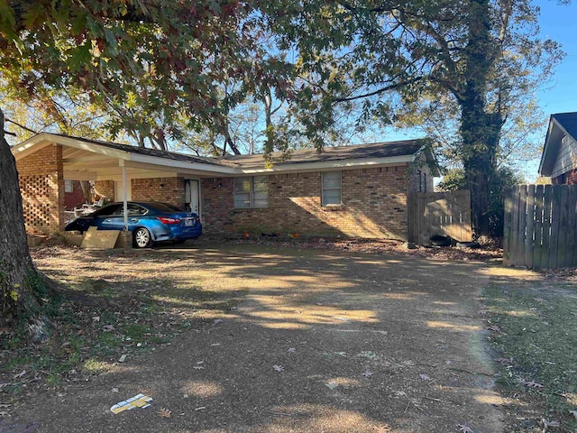 exterior space featuring a carport