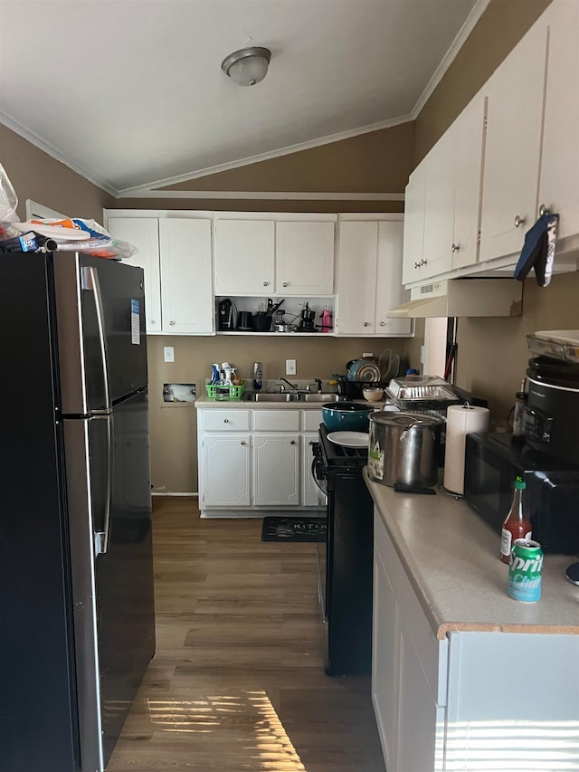 kitchen with black appliances, dark hardwood / wood-style flooring, white cabinetry, and vaulted ceiling