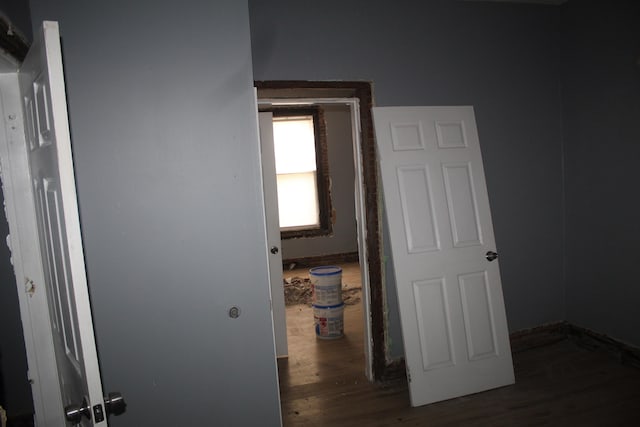 corridor with dark hardwood / wood-style floors