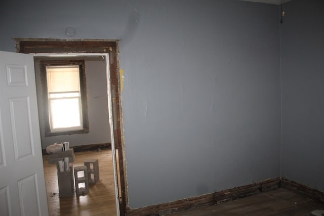 empty room with hardwood / wood-style floors